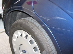 Blue car with scratches