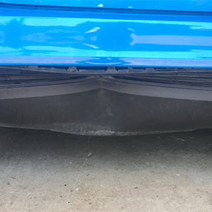 Before paintless dent repair of rear bumper